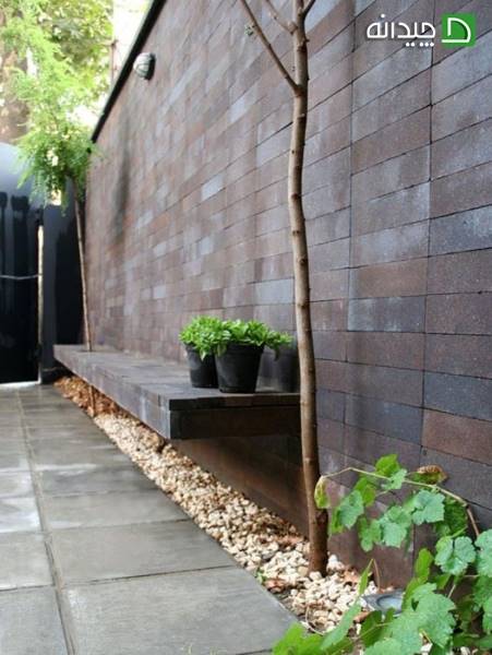 طراحی دیوار حیاط در خانه آجر بافت جیحون