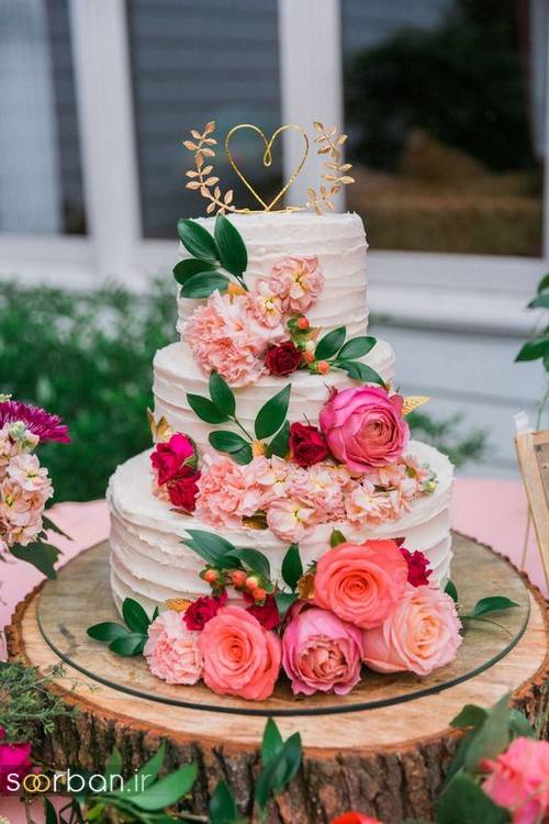 عکس مدل کیک عروسی با روکش خامه و گل های شاد و زیبا