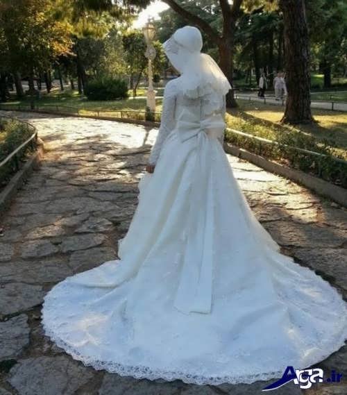 مدل لباس عروس پوشیده دنباله دار 