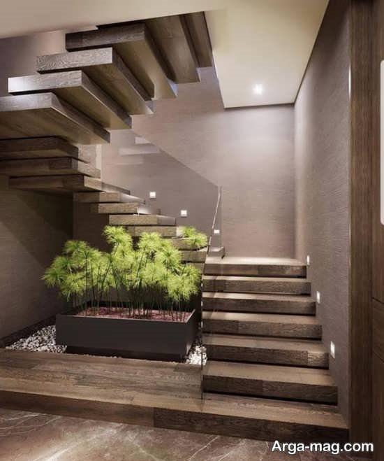 دیزاین قشنگ زیر راه پله با گل های طبیعی