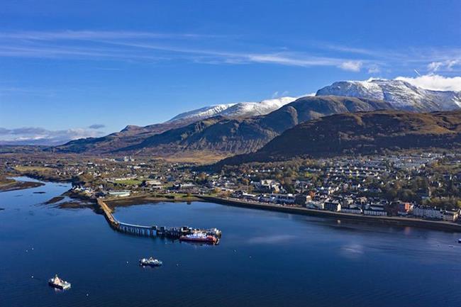 Aerial view of Fort William and snow capped Ben Nevis
