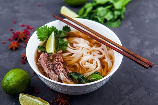 Pho Bo - Vietnamese fresh rice noodle soup with beef, herbs and chilli. Photo: CheDima/Shutterstock