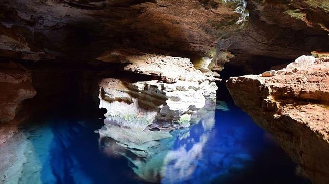 Visitors can swim in the blue waters of Poço Azul, in Bahia.Canva